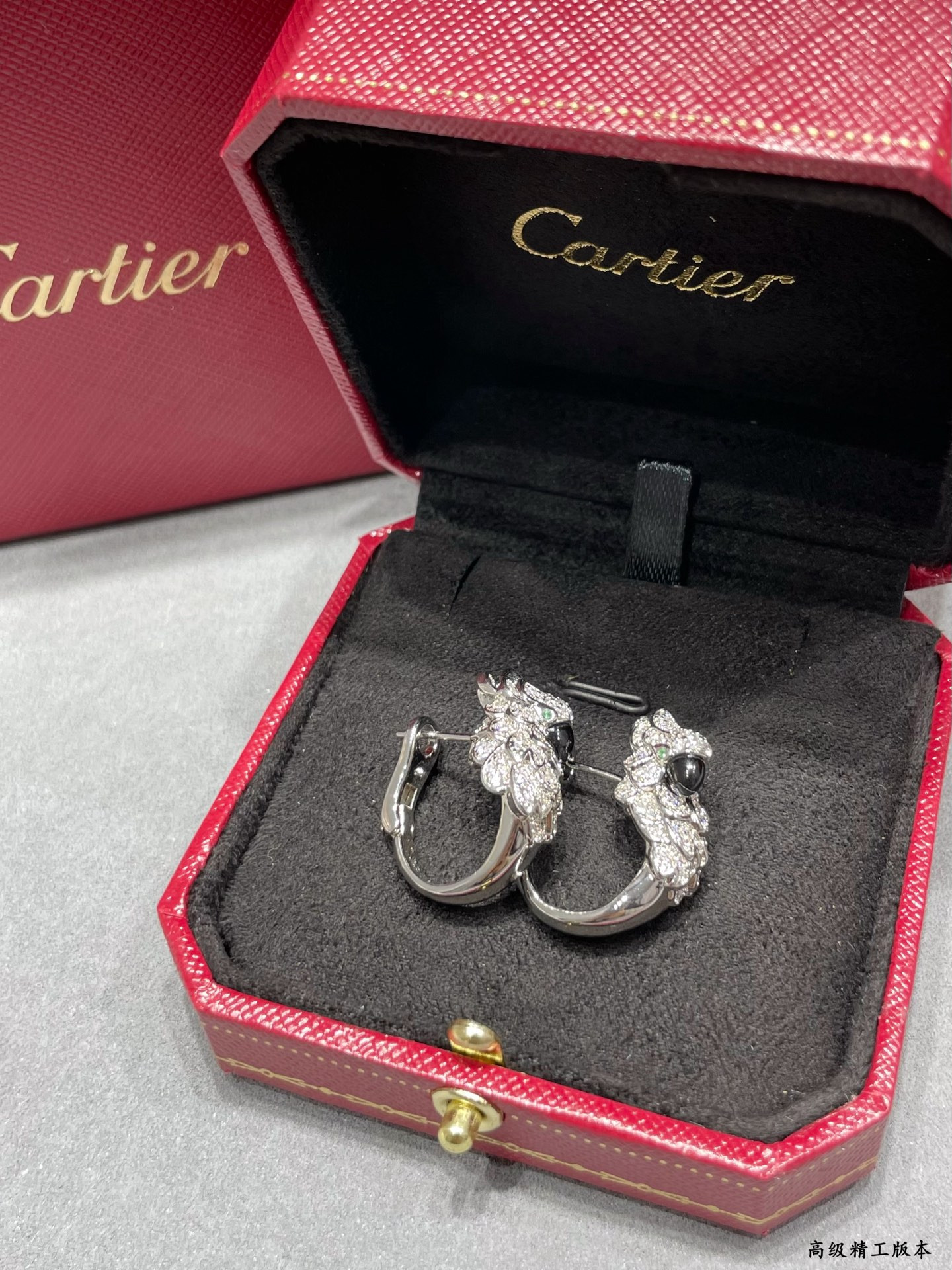 Ca*t1er Parrot Earrings