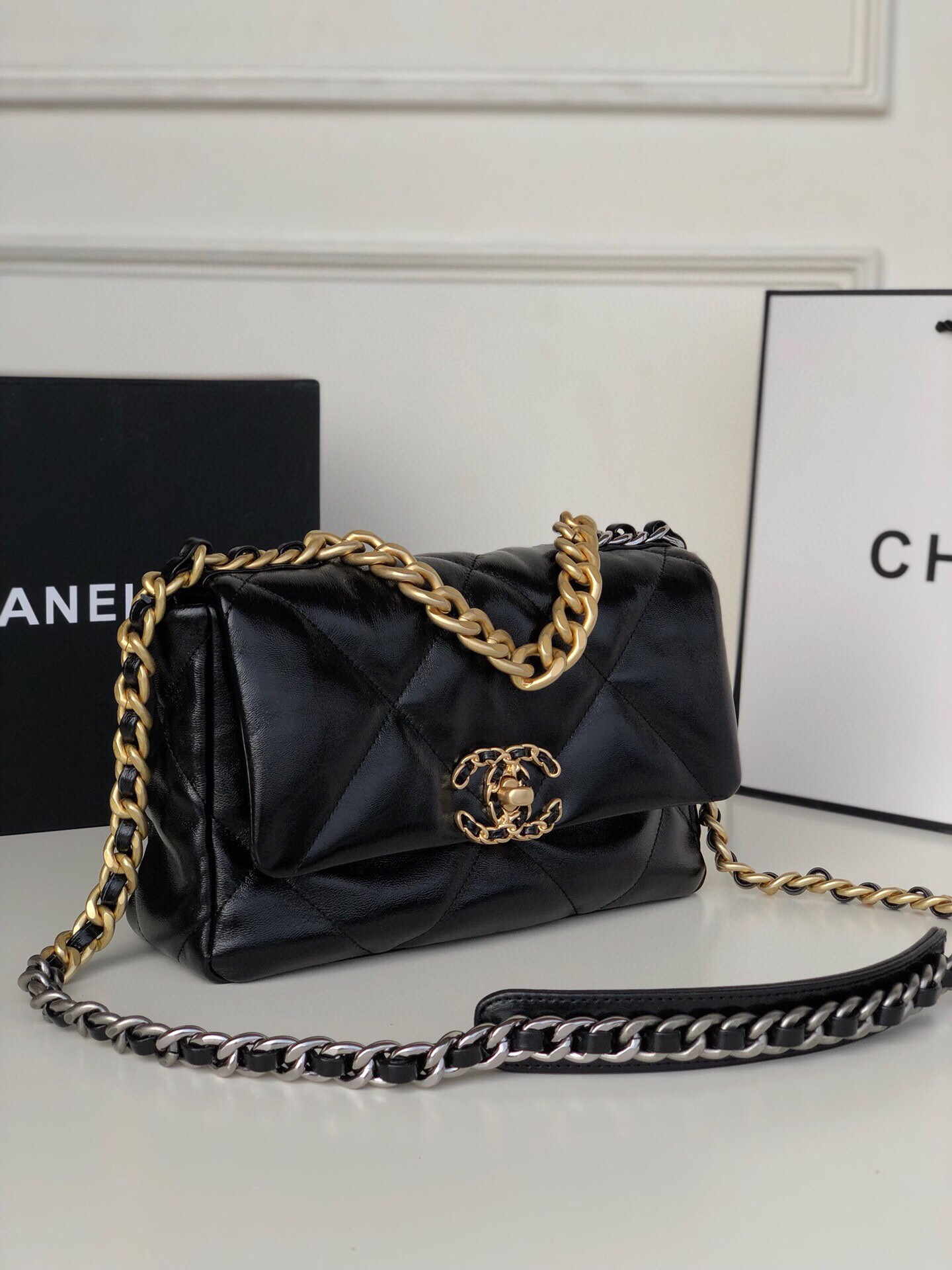 Ch**el 19 HANDBAG Shiny Leather, Gold-Tone, Silver-Tone & Ruthenium-Finish Metal Black 6.2 × 10.1 × 3.5 in